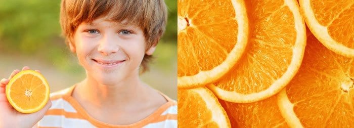 Ребенок с апельсином