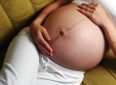 Боль в пупке во время беременности
