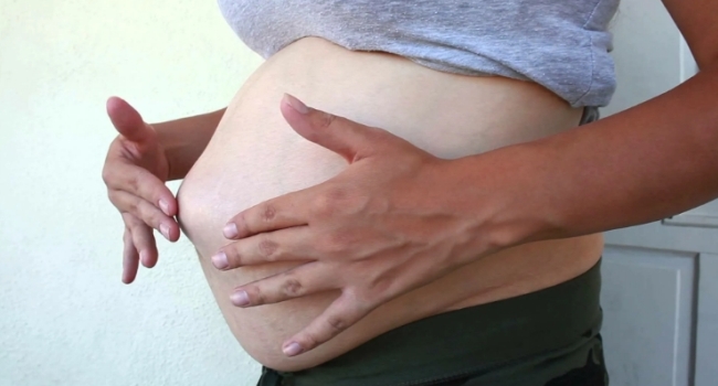 Боль в пупке во время беременности